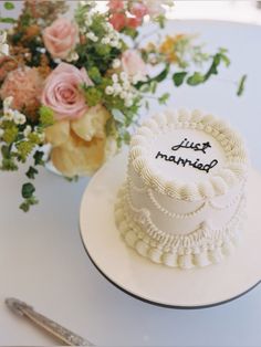 a wedding cake with just married written on it