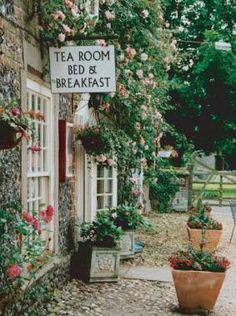 there is a sign that says tea room bed and breakfast in front of the building