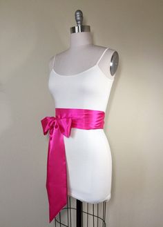 "Shocking Pink Sash Pink Satin Sash Belt Obi Belt, Bright Pink Hot Pink Sash Wedding Sash, Bridal Sash Bridesmaid Dress Sash Satin Swank Make this Satin Swank® reversible waist sash the perfect finishing touch for your wedding, bridesmaid, or special occasion dress, or just the right piece to add instant polish to your dress or top. This extra long version is 3.5 inches wide, 120 inches long, and will wrap around most waist sizes two times with a generous length remaining to tie in a bow or a si Pink Bridal Belt With Sashes For Party, Satin Bridal Belt For Bridesmaids, Fitted Bridesmaid Sash, Wedding Sash Belt, Waist Sash, Shocking Pink, Satin Sash, Dress Sash, Wedding Sash