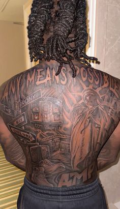 the back of a man with tattoos on his body