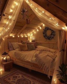 a bedroom with lights strung from the ceiling, and a bed in the corner that has a canopy over it