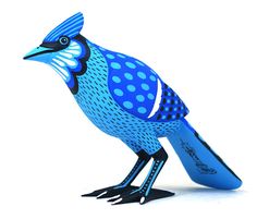 a blue bird with polka dots on it's body is standing in front of a white background