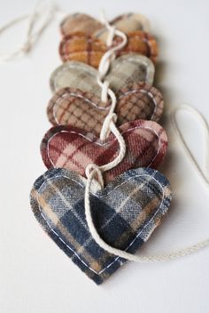 several plaid hearts are tied up together