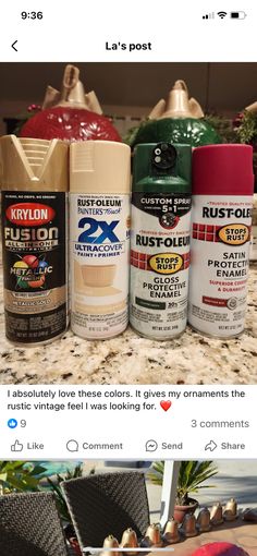 several different types of spray paint sitting on top of a table next to each other