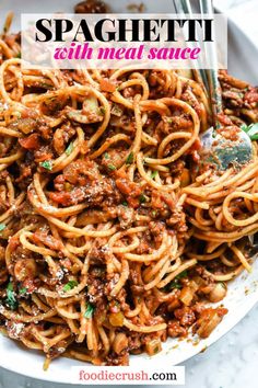 Spaghetti with Meat Sauce | foodiecrush.com Image shows an overhead closeup shot of a white dinner bowl filled with spaghetti and meat sauce, topped with freshly grated Parmesan cheese and some fresh parsley, with a large silver  fork in the bowl Spanish Spaghetti, Easy Spaghetti Recipe, Best Spaghetti Recipe, Spaghetti With Meat Sauce, Spaghetti With Meat, Clam Sauce Linguine, Spaghetti Recipes Easy