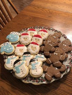 a plate full of decorated cookies on a table