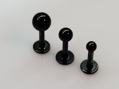 Standard Shipping is 11-14 Business Days. Holidays = Longer.  If needed as a gift or faster. Please Upgrade Shipping.  Black 14g 8mm Labret Gauge: 14 Gauge (14g) Length 8mm (5/16") Short Labret Post Ball Sizes 3mm, 4mm, 5mm Material: 316L Surgical Stainless Steel Post Color Black Quantity Sold Single 1, Or a set of 3 Notes Will Fit:  Helix, Tragus, Ear, Cartilage, Labrets Also Available in 16g And 18g Ask for details I ship Fast! Please have all your info right.  Orders ship same to next busines Triple Forward Helix, Triple Helix, Helix Ring, Tragus Ring, Labret Piercing, Labret Studs, Black Gems, Lip Ring, Small Flat