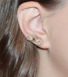 ⋙ 14kt Gold Filled garnet ear climber.⋙ This listing is for one ear climber.⋙ This climber is made of 20 gauge wire.⋙ Available gemstones: ruby; emerald; swiss blue topaz; light blue opal; kiwi green opal; black onyx; black-red opal; white pearl; blue sapphire; lapis lazuli; amethyst; clear white topaz; turquoise; garnet; white opal⋙ Measurements:⋙ The stone is 3mm in diameter⋙ ⋙ I will put your order into a beautiful jewelry box (it will be ready for gift giving). Elegant Yellow Gold Internally Threaded Ear Cuff, Elegant Red Ear Cuff As Gift, Elegant Red Ear Cuff For Gift, Elegant Red Ear Cuff Gift, Elegant Gemstone Cartilage Earrings As Gift, Elegant Gold Gemstone Cartilage Earrings, Elegant Gold Cartilage Earrings With Birthstone, Gold Elegant Cartilage Earrings With Birthstone, Ear Sweeps