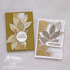 two cards with gold foil and leaves on them