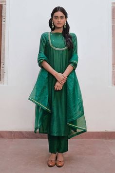 Bottle green kurta with cutdana, zari, sequin embroidered yoke. Paired with straight pant and dupatta.
Components: 3
Pattern: Embroidery
Type Of Work: Zari, sequin, cutdana
Neckline: Boat neck
Sleeve Type: Three quarter
Fabric: Handwoven Chanderi Silk
Color: Green
Other Details: 
Back keyhole
Length:
Kurta: 48 inches
Pant: 38 inches
Occasion: Sangeet - Aza Fashions Green Chanderi Unstitched Suit For Eid, Green Raw Silk Kurta With Sheer Dupatta, Green Chanderi Unstitched Suit With Sheer Dupatta, Green Cotton Silk Sets With Sheer Dupatta, Green Raw Silk Unstitched Suit With Dabka Details, Green Dola Silk Churidar In Straight Kurta Style, Green Raw Silk Unstitched Suit With Dabka, Green Dola Silk Churidar With Straight Kurta, Green Cotton Silk Kurta With Sheer Dupatta