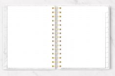 an open planner with gold foil on the pages