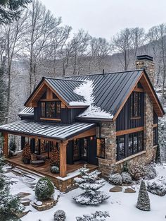 a house in the woods covered in snow