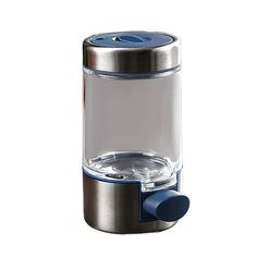 a glass and metal container with a blue lid