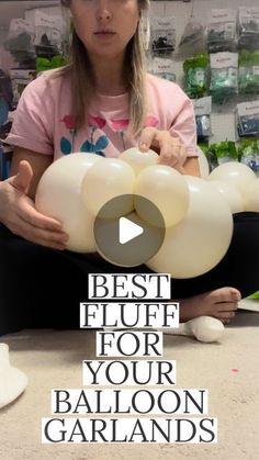 a girl holding balloons in her hands with the caption best glue for your balloon garlands