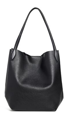 PRICES MAY VARY. Expandable sides with interior clasp Length: 13in / 33cm, Height: 12.5in / 32cm, Handle drop: 9.5in / 24cm, Depth: 7.5in / 19cm Shoulder straps Unlined Weight: 28oz / 0.79kg Madewell Tote, Women's Totes, Madewell Bags, Everyday Purse, Black Leather Tote, Autumn Style, Straw Tote, Trending Handbag, Shopper Tote