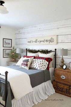 a bedroom with white walls and wood paneling on the wall, bedding is neatly made