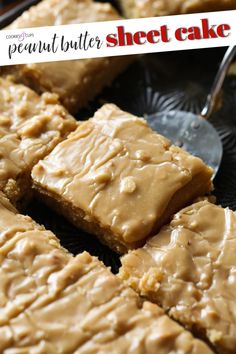 peanut butter cake on a black plate with a spoon in front of it and a sign that says, peanut butter cake