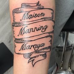 a person with a tattoo on their arm that says mason manning, maraya and madison