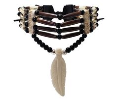 - This choker is made from authentic buffalo bone feather pendant, buffalo bone hairpipe beads, genuine leather, 6mm round metal beads, and 6mm round black synthetic beads. - The neckline is 13.5 inches long (without the leather ties). - The pendant is hand carved from authentic buffalo bone. - This is a traditional 4 strand tribal bone choker. - This jewelry is 100% handmade in the USA. We accept custom orders, just message us to discuss your ideas. Bone Choker, Peter Quill, Bone Jewelry, Jewelry Fashion Trends, Feather Pendant, Bone Beads, Black Feathers, Fantasy Jewelry, Choker Necklaces