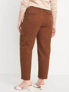 button front belt loops diagonal front pockets back flap pockets flap-cargo pockets at thigh sits at belly button relaxed hip and thigh straight leg hits at ankle 27" regular inseam 25" petite inseam 30" tall inseam models are approx.  5'9" and wear sizes s (4), l (12), and xl (18)machine wash according to the care instruction label Mid-rise Brown Bottoms With Cargo Pockets, Brown Mid-rise Bottoms With Cargo Pockets, Brown Mid-rise Utility Cargo Pants, Brown Utility Style Mid-rise Cargo Pants, Utility Brown Mid-rise Cargo Pants, Brown Mid-rise Utility Bottoms, Brown Mid-rise Utility Cargo Jeans, Brown Utility Mid-rise Cargo Jeans, Utility Style Mid-rise Brown Cargo Jeans