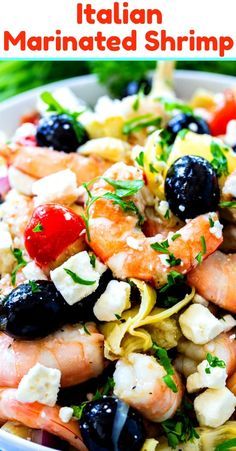 this pasta salad has shrimp, olives, and fettuccine in it