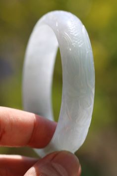 Thank you for looking at this listing! Up for sale is: Carved White Jadeite Jade Asian Chinese Dragon Phoenix Happiness Bangle Bracelet 58.6g (58mm) Used, please see pictures for details on condition. Stone tests in the jadeite jade range and is over 73x15 in outer diameter & width. Inner diameter is 58.79mm. I do not know if it is natural or lab created. I'm not an expert in rating condition, so please look carefully at the pictures and ask questions. What you see is what you get, sold As-I Chinese Ring, Dragon Phoenix, Jade Dragon, Floral Pendant, White Jade, Jade Bracelet, Chinese Dragon, Bracelet Clasps, Vintage Bracelets