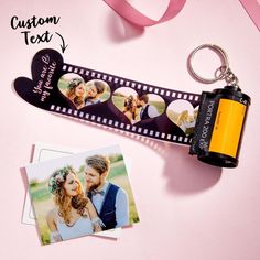 a couple's photo is attached to a keychain with two pictures on it