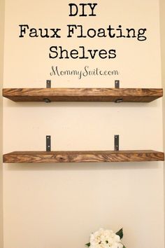 two wooden shelves with flowers on top and the words diy faux floating shelves above them