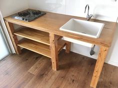 a wooden table with a sink underneath it