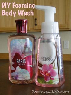 two bottles of body wash and lotion sitting on a table with the words diy foaming body wash