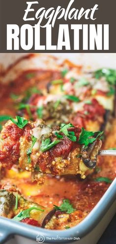 an eggplant rollatini is being lifted from a casserole dish