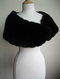 FASHION FURS Item Description: Exceptional quality and a glamorous look. Crafted from natural dark ranch/black mink fur pelts, it is designed to keep you warm and stylish. The soft and smooth texture of the Canadian full mink fur pelts ensures top quality. The stole is completed with a furrier closure and a mink fur pom pom at the front, while the black satin lining adds a touch of elegance. With measurements of 60" x 14", this stole is a must-have for any fashion-forward individual. Cape Shawl, Fur Accessories, Wedding Wraps, Mink Fur, Fur Pom Pom, Smooth Texture, Shawls And Wraps, Black Satin, Scarf Accessory