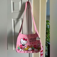 Hello Kitty Cafe Las Vegas Exclusive New Releases Crossbody Bag Las Vegas Exclusive Measurements: 18” X 11” Brand New With Tag Hello Kitty Print School Shoulder Bag, Hello Kitty Print Shoulder Bag For Travel, Casual Hello Kitty Print Shoulder Bag, Casual Hello Kitty Print Tote Shoulder Bag, Hello Kitty Bags, Kitty Cafe, Hello Kitty Bag, Hello Kitty Pink, New Releases