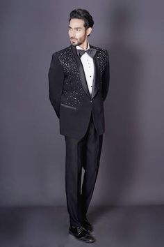 Black tuxedo blazer featuring intricate hand embroidery in scattered beaded, stones and cutdana work. Comes with a white shirt, pant and a bow-tie. - Aza Fashions Embellished Fitted Suits For Gala, Fitted Embellished Suits For Gala, Tailored Embellished Suits For Gala, Tailored Wedding Suits With Sequins, Black Sequin Suits For Formal Occasions, Elegant Sequin Tuxedo For Formal Occasions, Tailored Sequin Suit For Formal Occasions, Embellished Notch Lapel Suits For Semi-formal Occasions, Embellished Tailored Tuxedo Suits