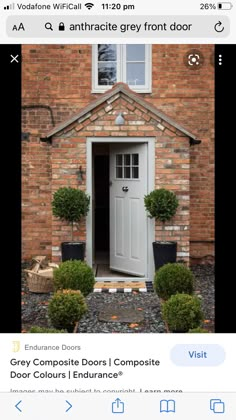 an instagramted post about grey composite doors in front of a red brick house