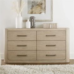 a wooden dresser sitting on top of a white rug