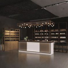 an empty bar with lots of bottles on the shelves and lights hanging from the ceiling