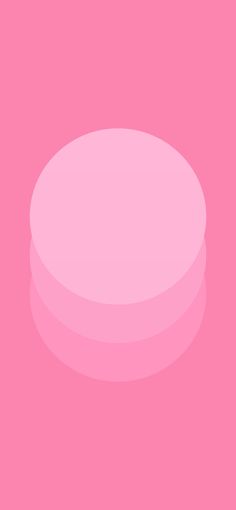 a pink round object on a pink background