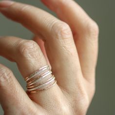 These dainty stacking rings have great texture and sparkle. The design is clean and simple, and the unique texture adds a little sophisticated whimsey when worn alone or paired with other stackers. Available in sterling silver or 14k yellow or rose gold fill. The width of the band is around 1.5 mm. All Rebecca Haas Jewelry is handcrafted by me in my Southern Vermont Studio from recycled and ethically sourced materials. Dainty Hammered Rose Gold Rings, 14k Rose Gold Stackable Promise Rings, Wedding Hammered Rose Gold Stackable Rings, Hammered Rose Gold Stackable Rings For Wedding, Simple Hammered Rose Gold Jewelry, Dainty 14k Rose Gold Stackable Rings, Wedding Stackable Hammered Rose Gold Rings, Dainty Hammered Rings, Rose Gold Hammered Midi Rings