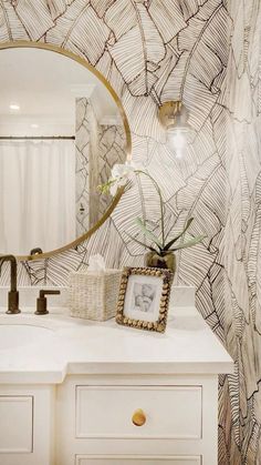 a bathroom with a mirror, sink and vanity