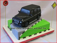 a cake made to look like a car on top of a ramp