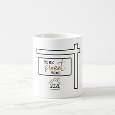 a coffee mug with the words home sweet home on it