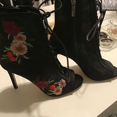 Gorgeous Black Embroidered Lace Up Booties. Size 6 1/2. New, Never Worn. Embroidered High Heel Boots For Spring, Black Heels With Floral Embroidery And Round Toe, Spring High Heel Boots With Floral Embroidery, Black Embroidered Evening Heels, Party Heels With Floral Embroidery And Round Toe, Spring Party Heels With Embroidery, Open Toe Heels With Floral Embroidery For Evening, Embroidered Black Heels For Summer, Embroidered Black Summer Heels