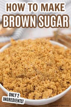 a bowl filled with brown sugar on top of a wooden table