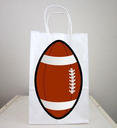 a paper bag with an image of a football on it