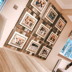 a living room filled with furniture and pictures on the wall