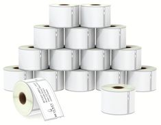 several rolls of toilet paper stacked on top of each other next to a roll of stickers