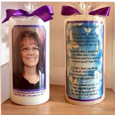 a candle with a photo on it next to an empty candle wrapper that has a purple ribbon