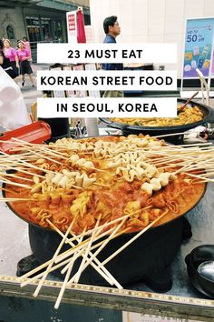 korean street food in seoul, korea with text overlay that reads 23 must eat korean street food in seoul, korea