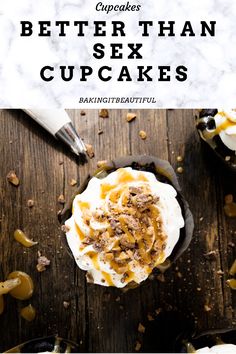 cupcakes with white frosting and caramel topping on top, sitting on a wooden table